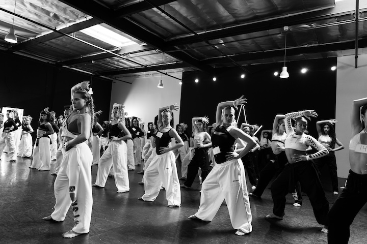 Young, focused dancers in a professional dance studio